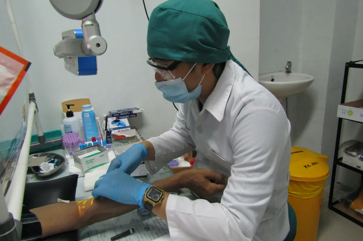 Dermatologist examining patient skin