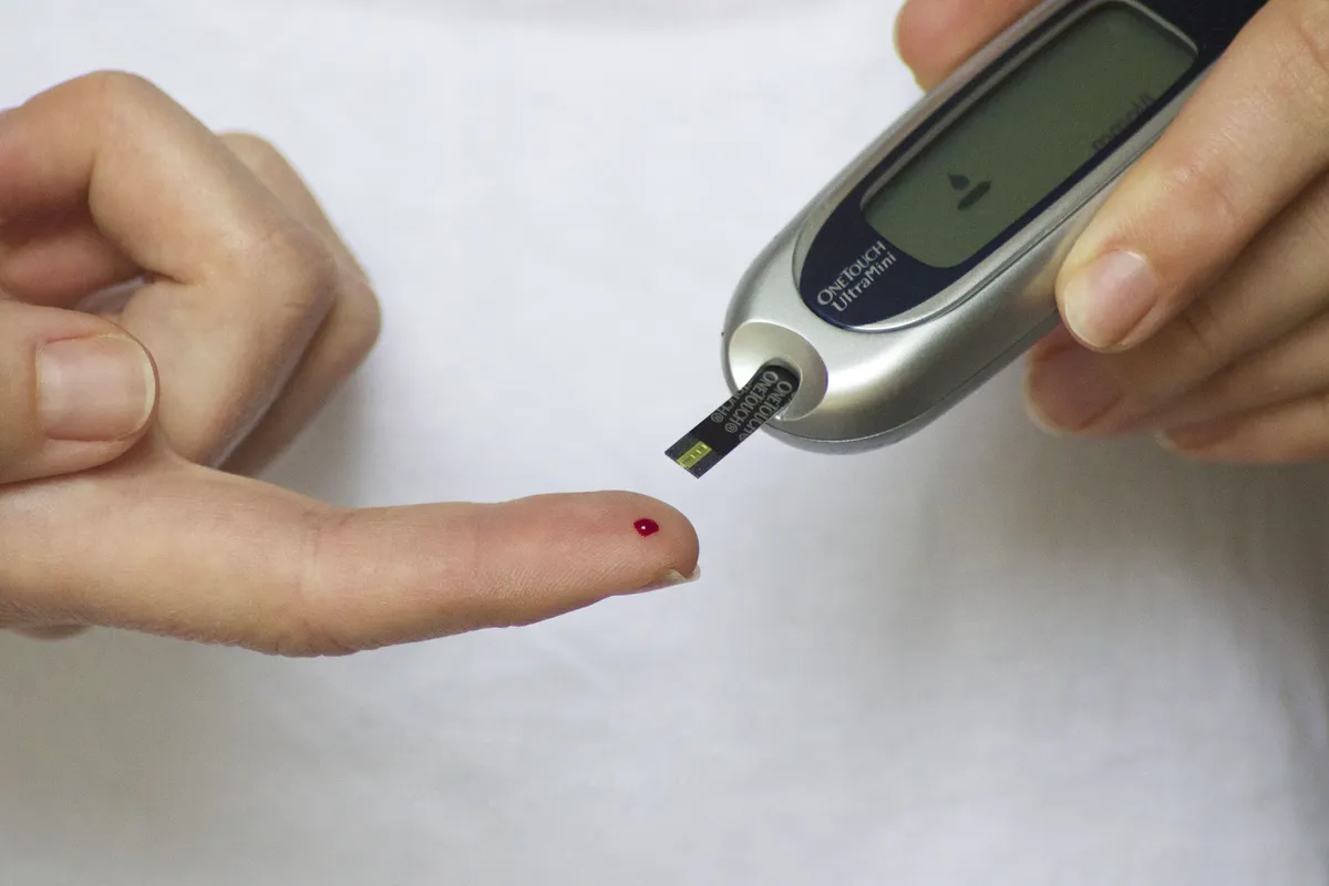 Doctor checking blood sugar levels