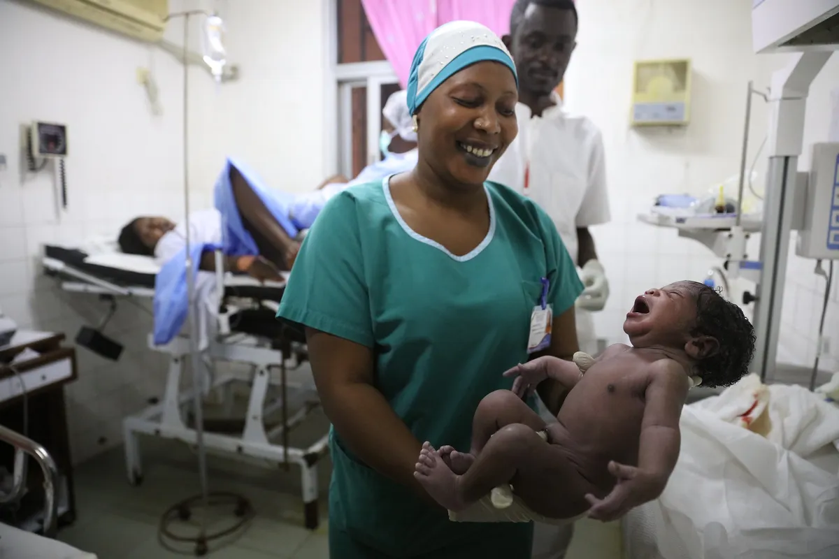 group of doctors in the surgery room after a successful childbirth operation