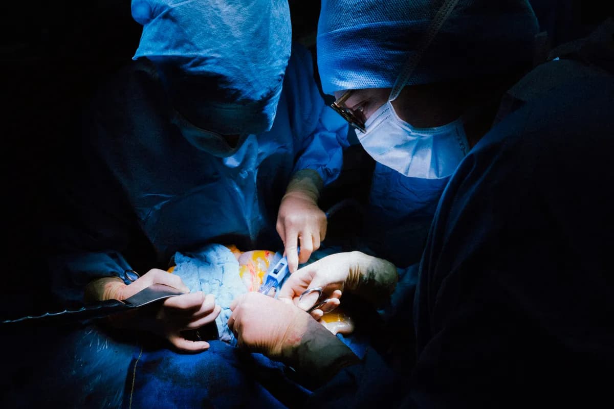 A group of doctors performing surgery on a patient